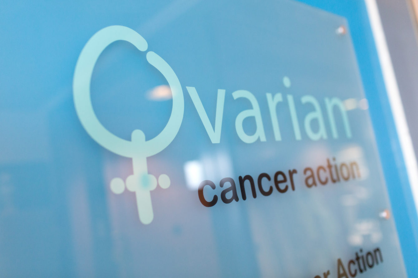 A signage saying Ovarian Cancer Action on it