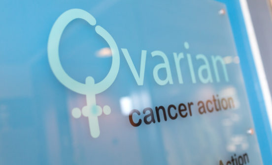A signage saying Ovarian Cancer Action on it