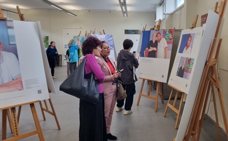 People observing the pictures on display