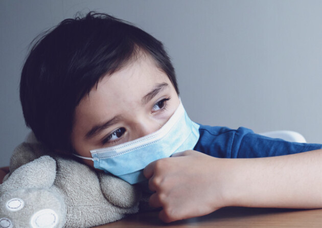 Child,Wearing,Medical,Face,Mask,Lying,His,Head,On,Teddy